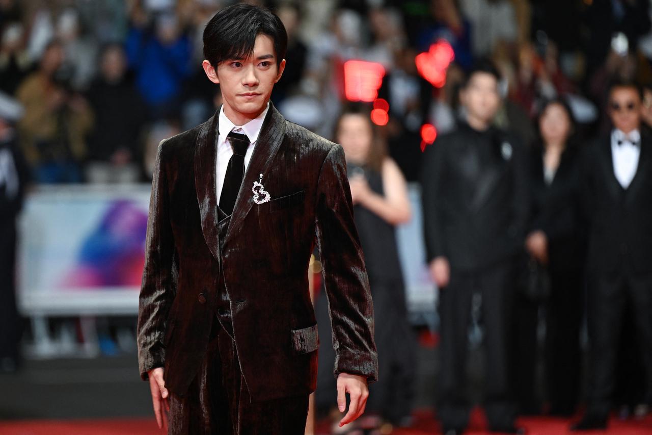 Chinese actor Jackson Yee looked suave as he arrived for the screening of the film 'Kuang ye shi dai' (Resurrection) 