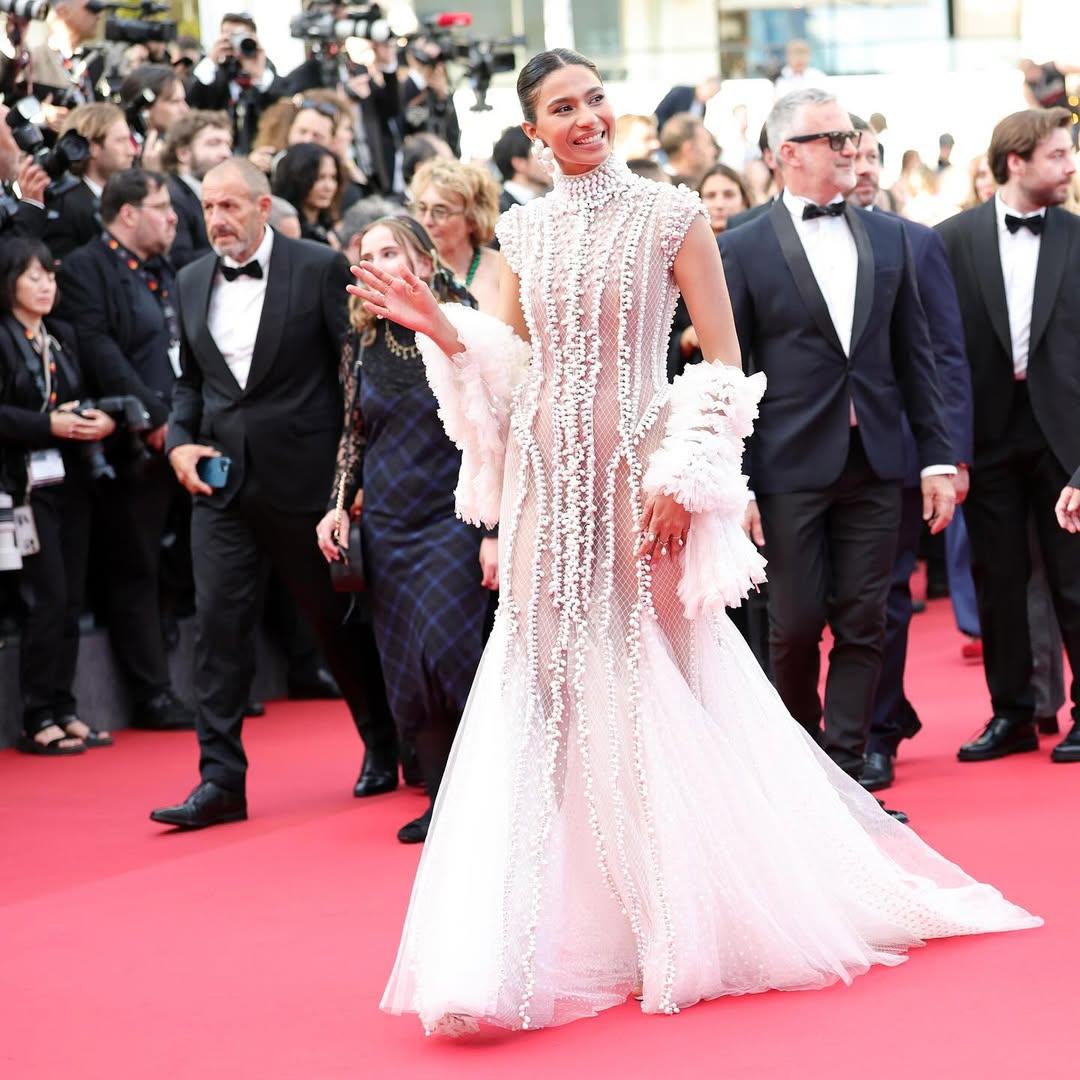 The lead actress of Anupam Kher’s Tanvi the Great debuted at Cannes in a white embroidered gown with a trailing hem, representing Indian cinema with elegance and poise