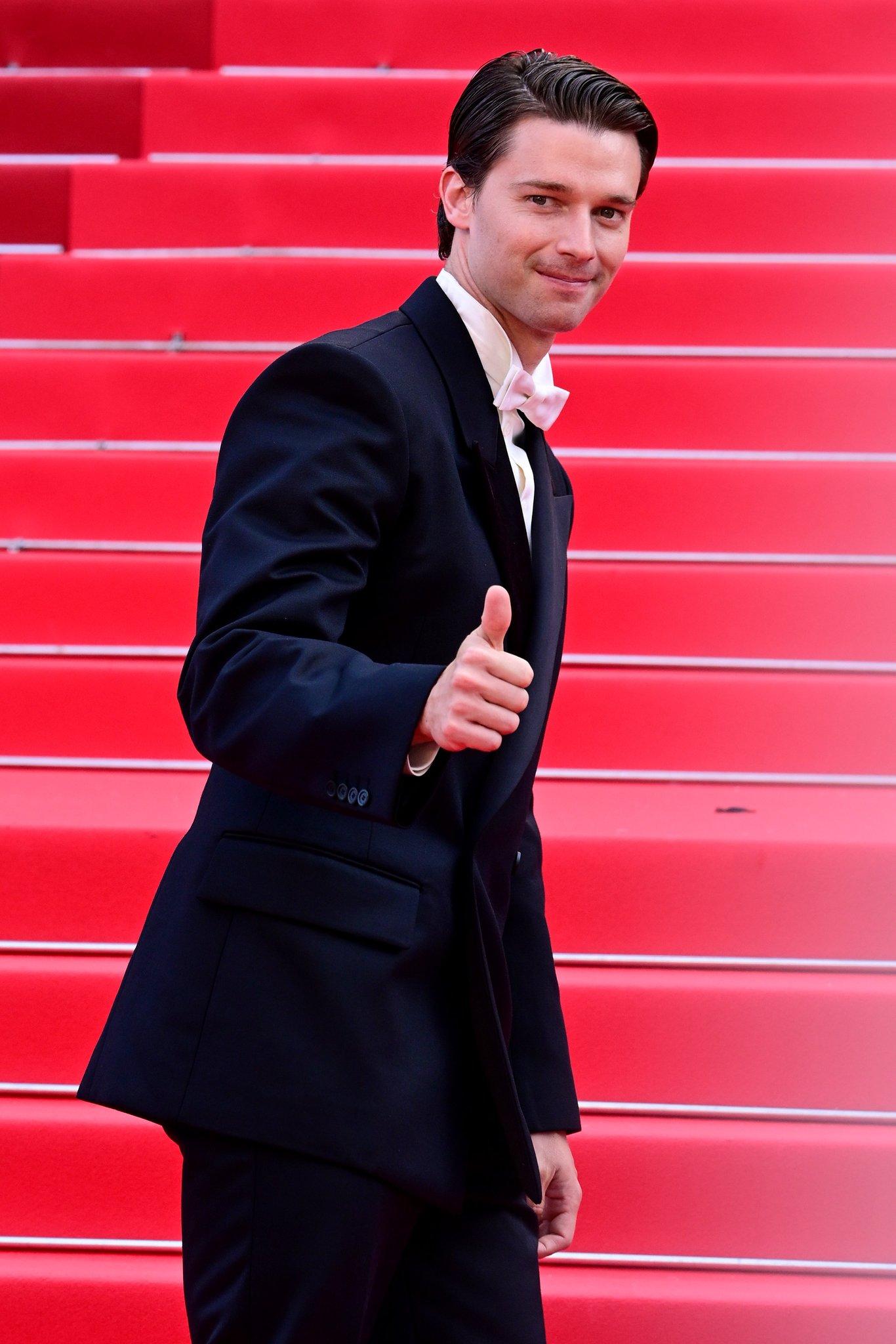 Patrick Schwarzenegger lit up the red carpet at The Phoenician Scheme premiere during the 78th Cannes Film Festival. Dressed in a white shirt, black blazer, and bow tie, he made a charming entrance, complete with his cute smile