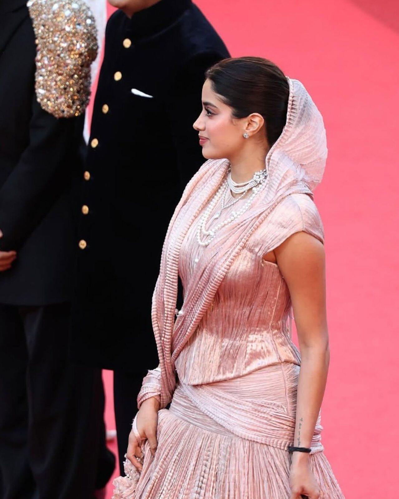 She wore a long pleated skirt and corset crafted in tissue, specially woven in Benaras. Rhea Kapoor styled the ensemble. She elevated the attire with an integrated duppata-like drape that was attached to her sleek bun