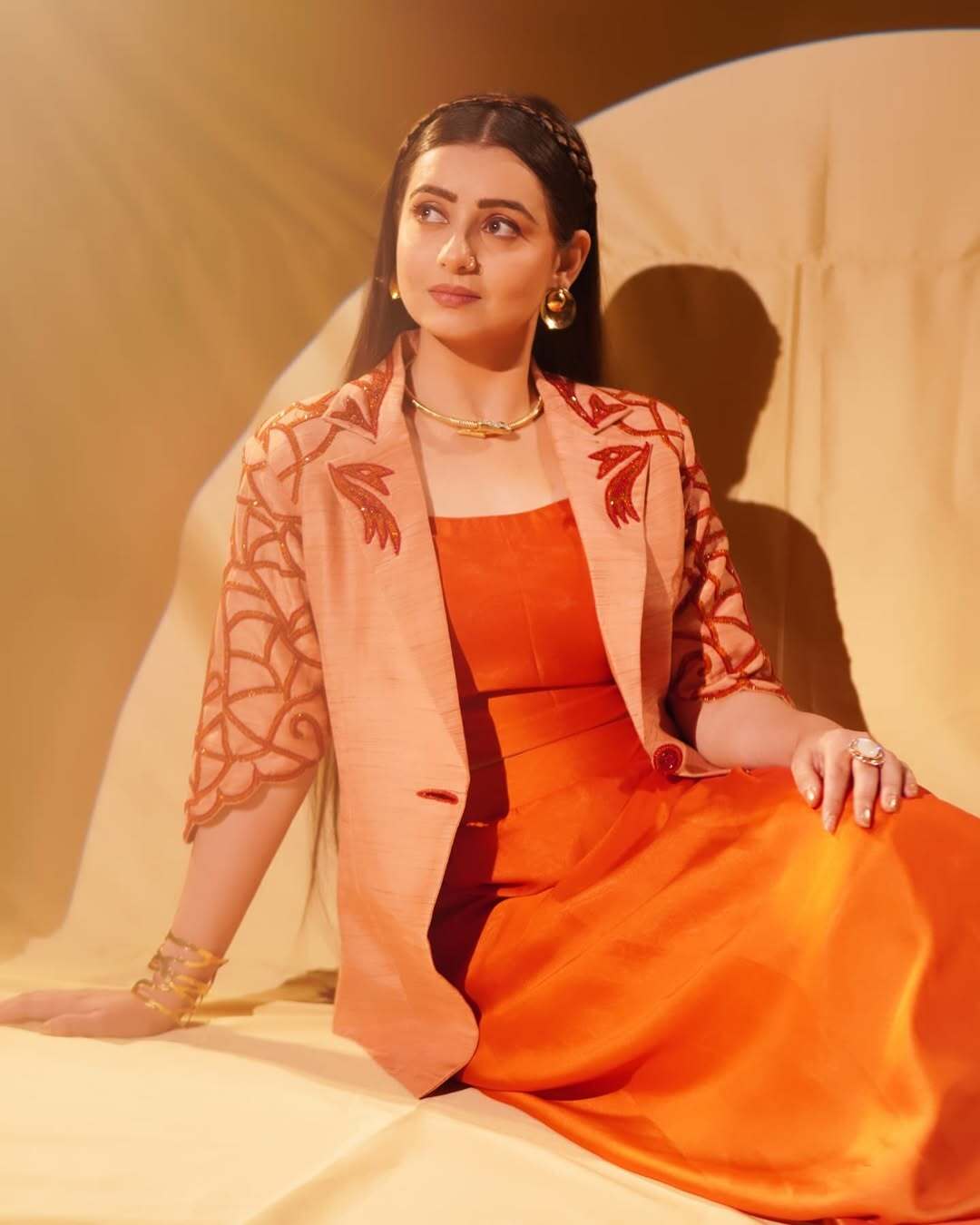 Chahat Pandey slays in every outfit she wears, whether it's a stunning saree or a stylish co-ord set. In this look, the actor was seen wearing a beautiful orange ensemble
