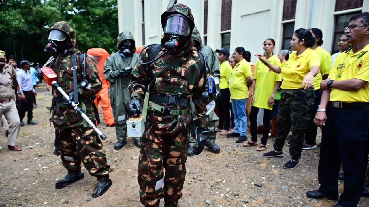 The mock drill began with the sound of a siren, signalling a simulated bombardment on a building
