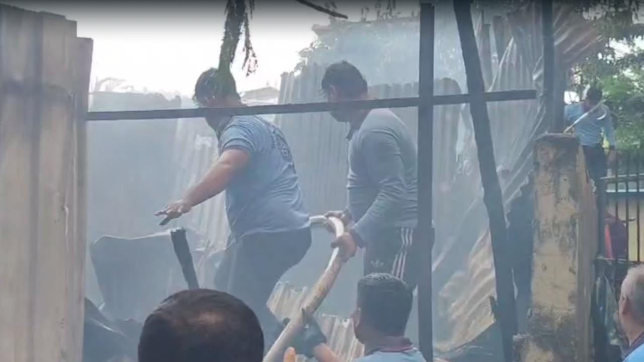 The fire spread rapidly in the afternoon heat, triggering explosions of two to three gas cylinders stored inside the huts