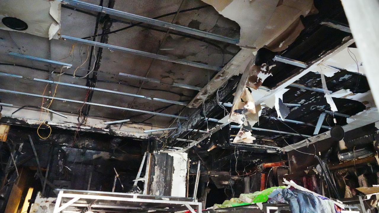 The showroom was shut at the time, which prevented any injuries. Extensive damage was caused to stock including garments, wiring, cameras, wooden partitions and hangers.