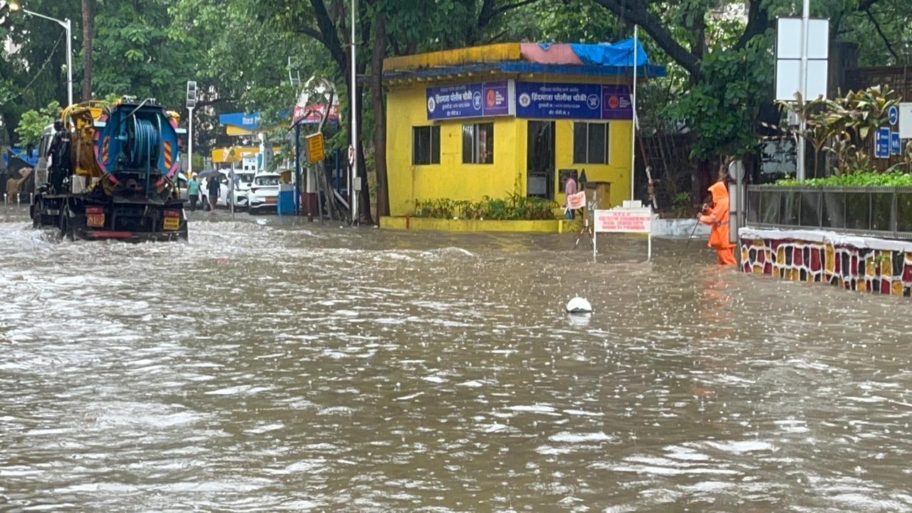 The usually busy thoroughfare wore a deserted look as the knee-deep water made it challenging for vehicles to navigate