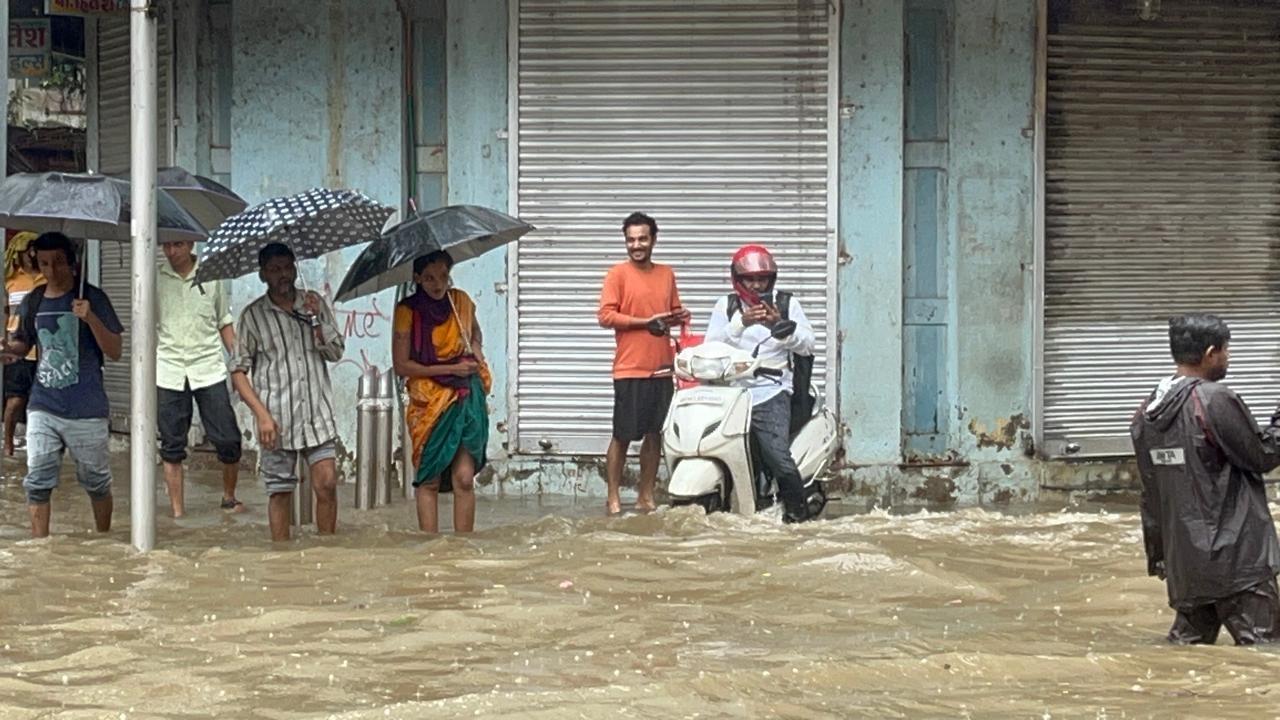 Shops and buildings along the stretch appeared inundated, forcing shopkeepers and residents to halt their daily routines