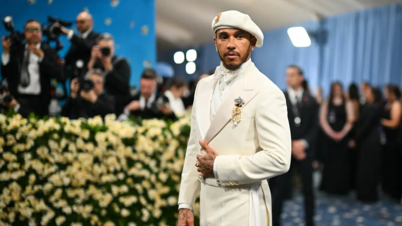Lewis Hamilton, the 105-time Formula One Grand Prix winner and Met Gala co-chair, made a commanding appearance. He wore an ivory ensemble designed by Wales Bonner, paired with a custom hat by Stephen Jones, a homage to refined masculinity and tailored grace