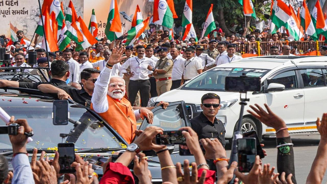 Prime Minister held the roadshow as part of his two-day visit to inaugurate and lay the foundation for several developmental projects in the state. Pic/ PTI