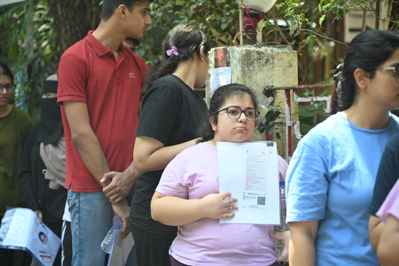 Heavy clothing or long sleeves must be avoided. Students wearing cultural or religious attire must report two hours early for detailed security checks.