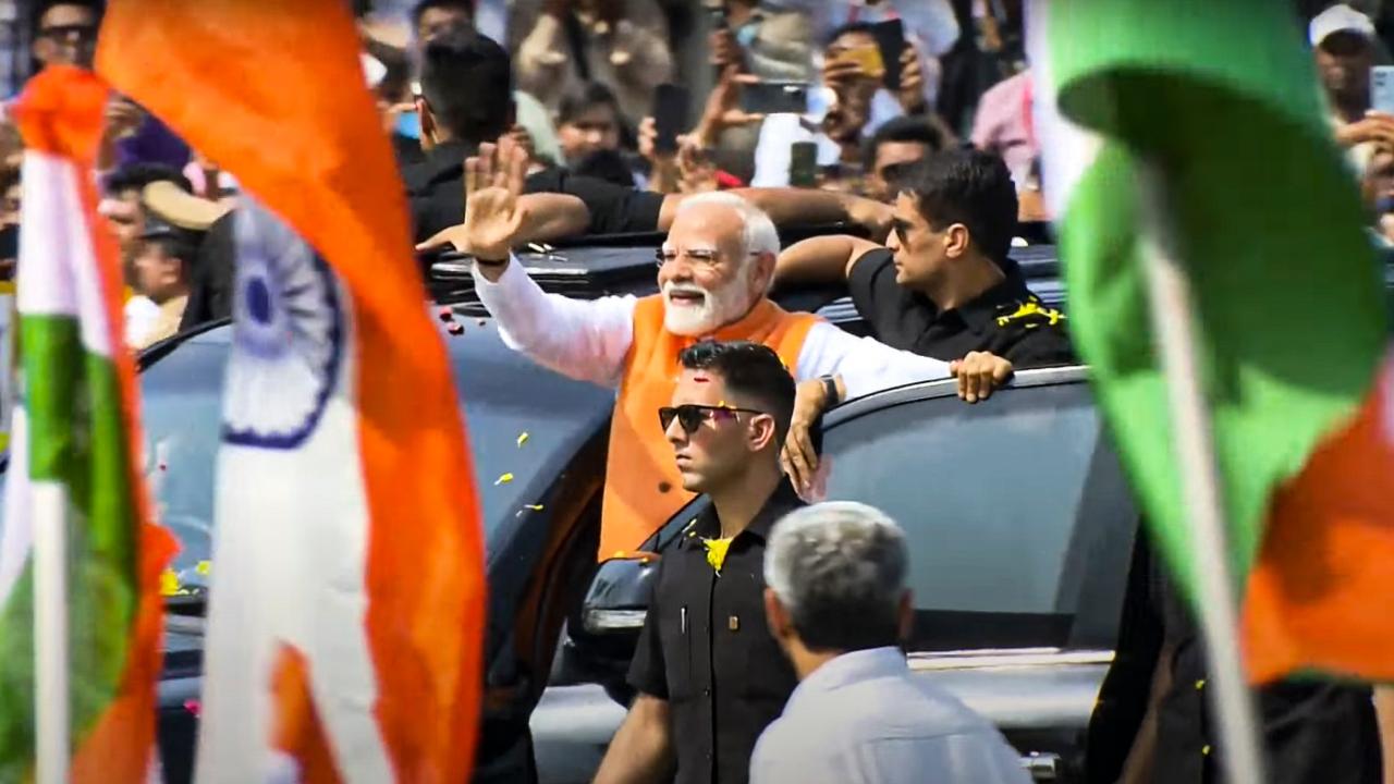 Family members of Indian Army Officer Colonel Sofiya Qureshi, who was part of the media briefings during Op Sindoor, were also present at the roadshow and showered the Prime Minister with flower petals