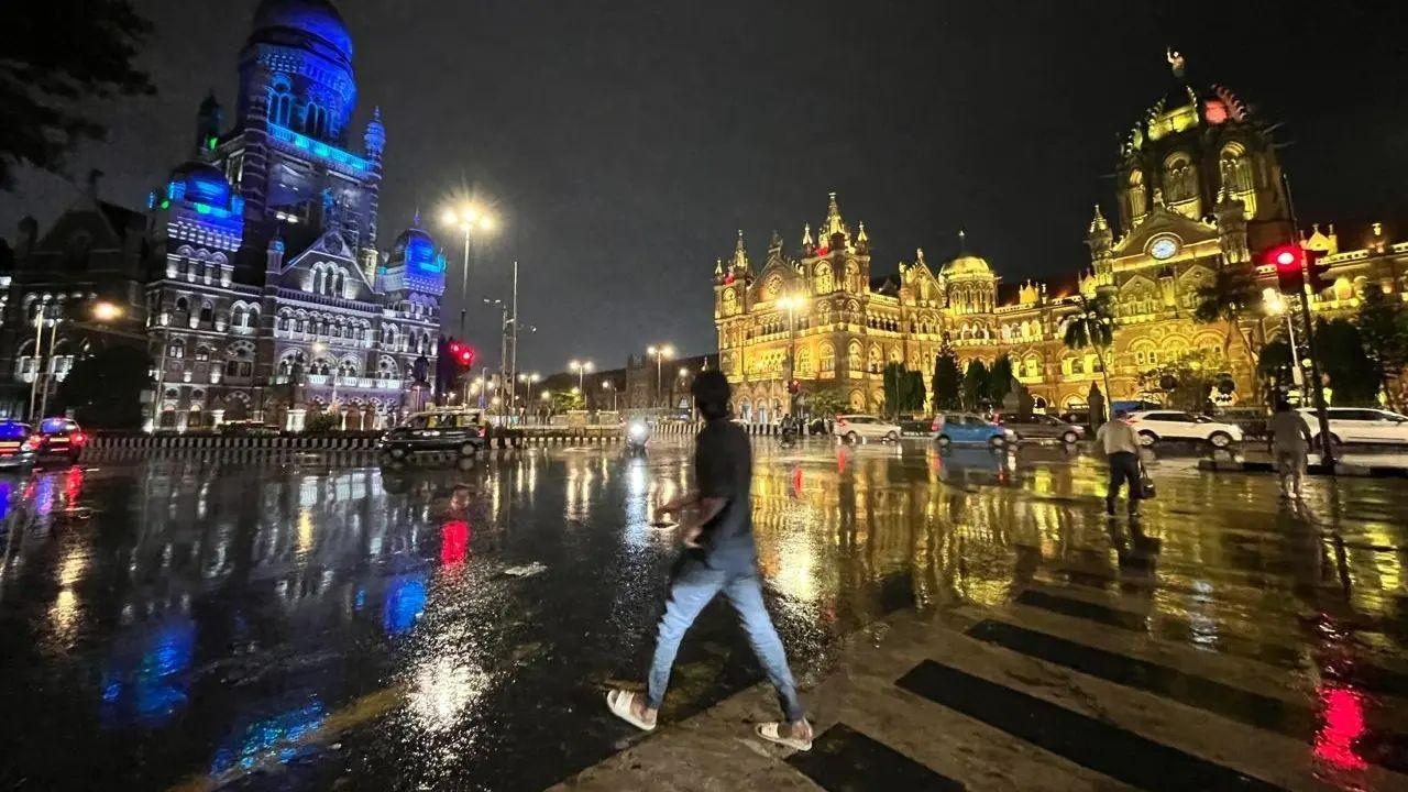 Mumbai’s monsoon nights turn the city’s iconic streets into luminous mirrors, where history, rain, and neon lights dance in perfect harmony. Pic/Satej Shinde, Kirti Surve and Atul Kamble