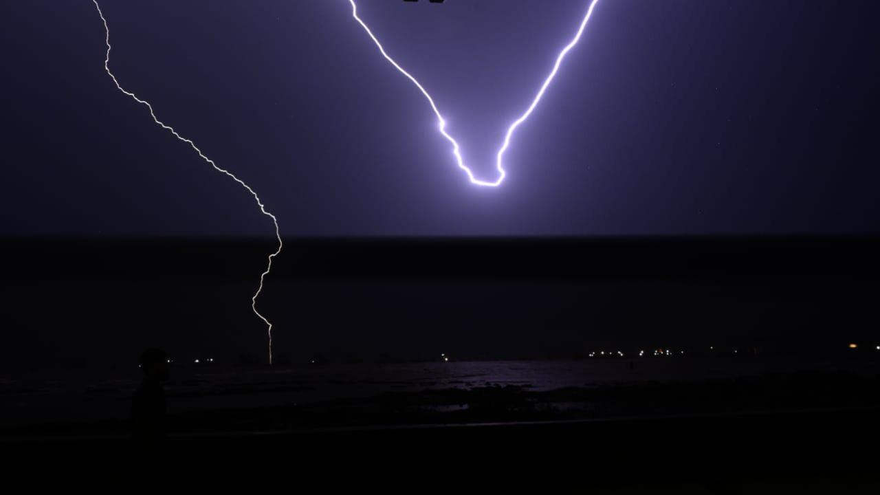 Thunder crackles across Mumbai’s night sky, painting the dark canvas with brilliant lightning streaks. Pic/Satej Shinde, Kirti Surve and Atul Kamble