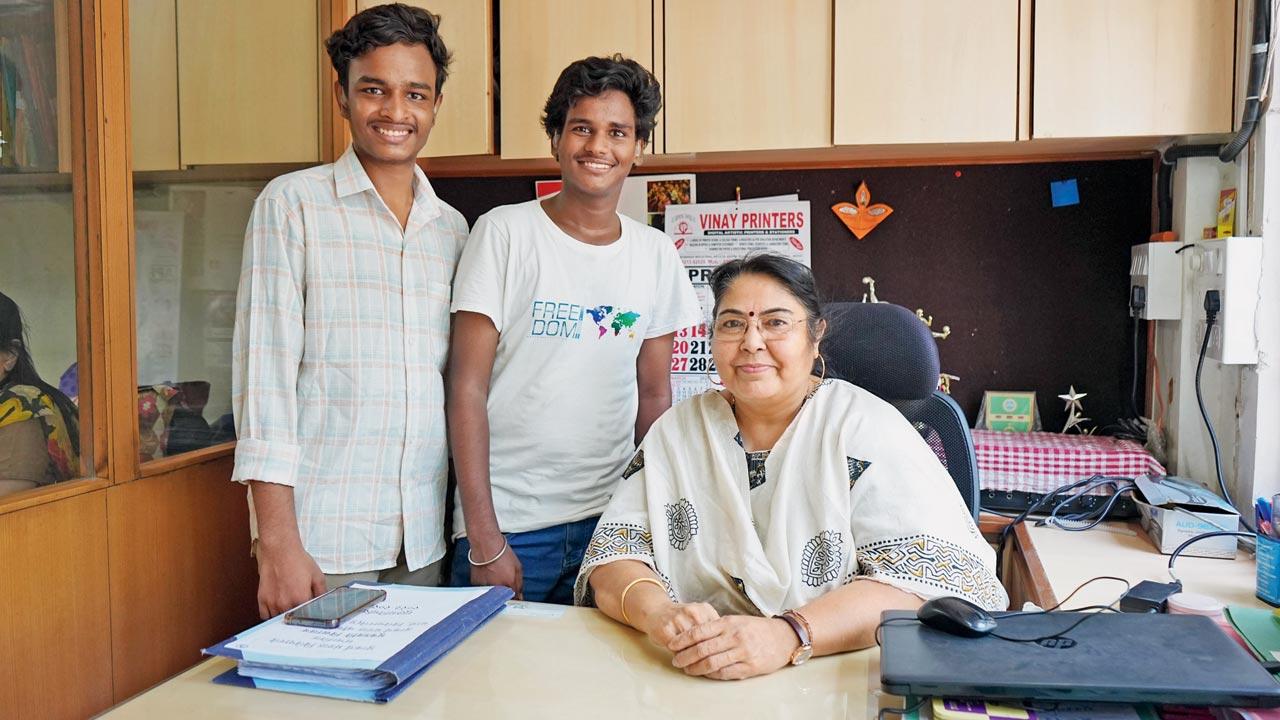 Students Rohit Pawar (left), Anand Sable with their principal, Neha Gandhi, at the Utkarsha Mandal Mookdhwani School in Vile Parle East. Pic/Dweep Bane