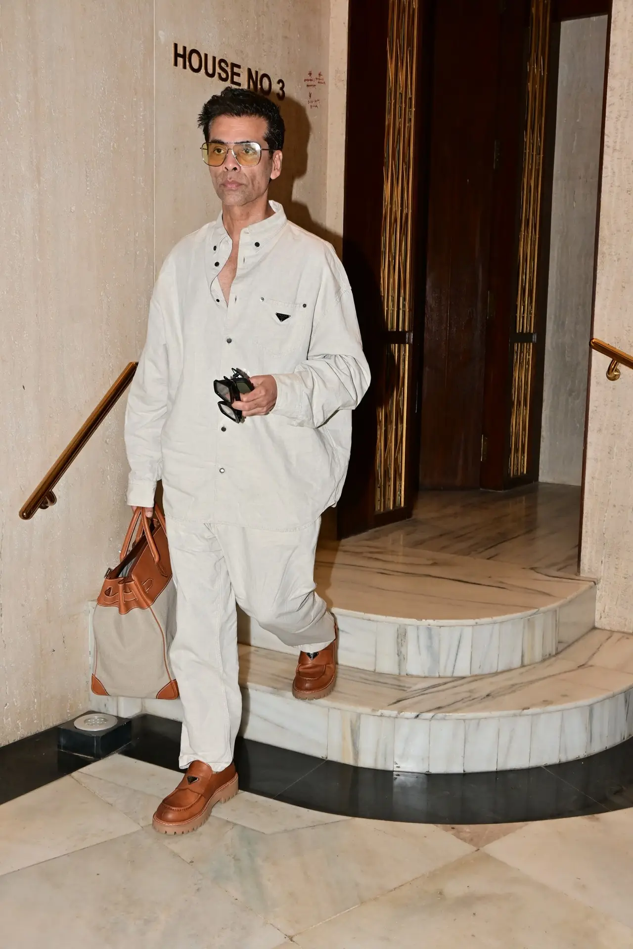 Karan Johar spotted in an all white outfit