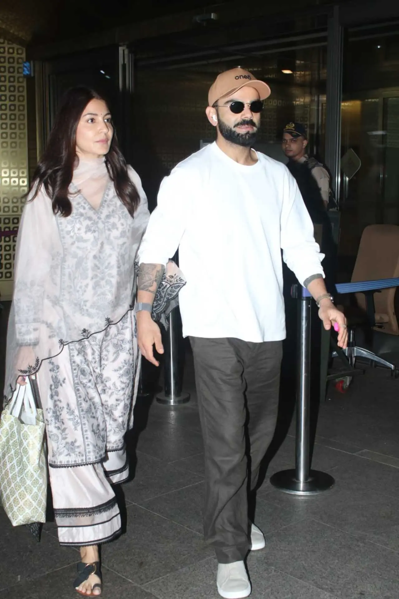 Anushka Sharma and Virat Kohli were spotted at the Mumbai airport as they returned from Delhi after a spiritual meet