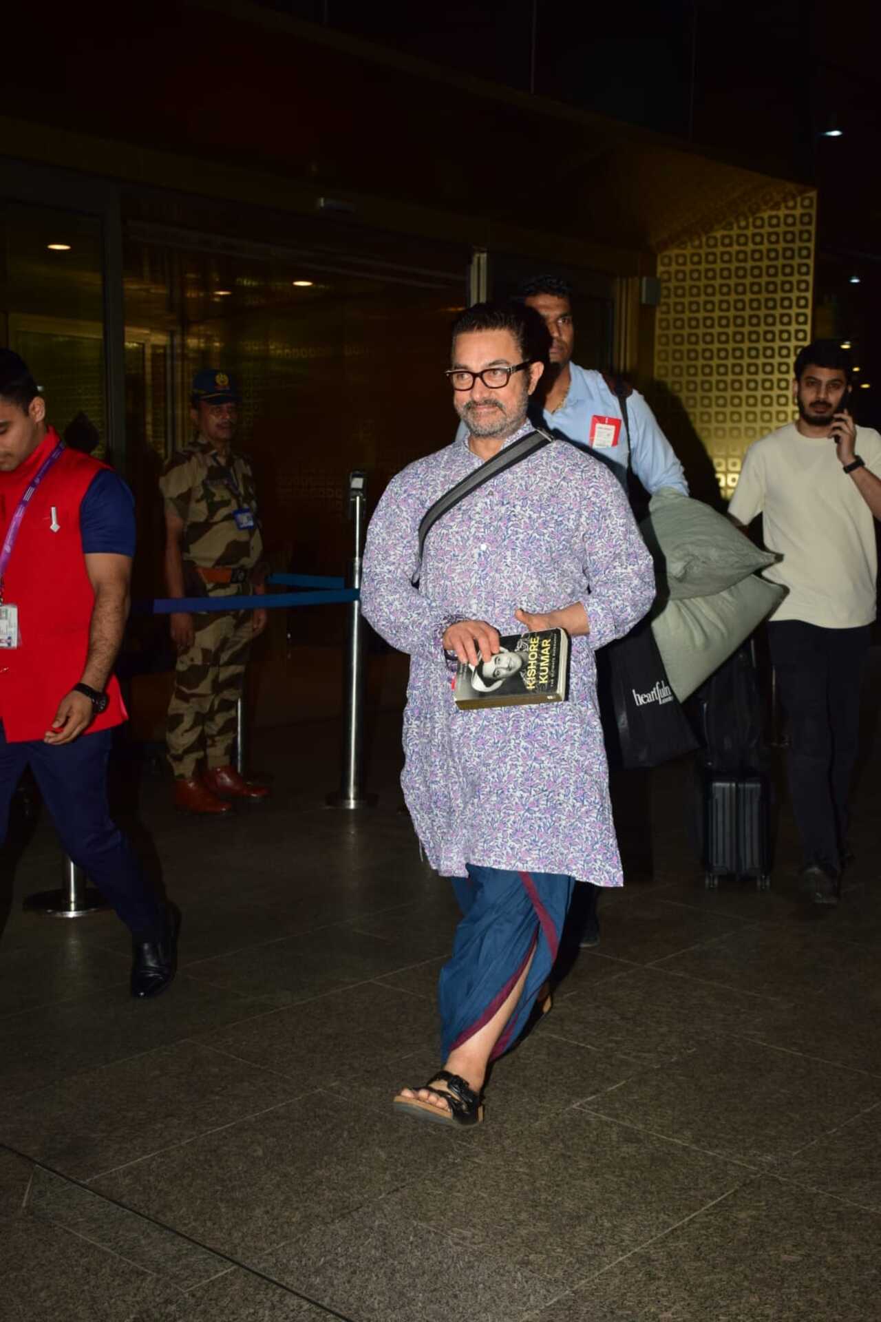 Aamir Khan was spotted at Mumbai airport holding a book on Kishore Kumar