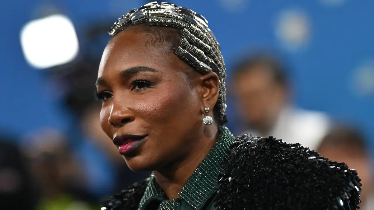 Venus Williams brought tennis-inspired flair to the carpet in an emerald green outfit featuring a pleated skirt, short in the front, cascading at the back, topped with a voluminous coat and collared blouse