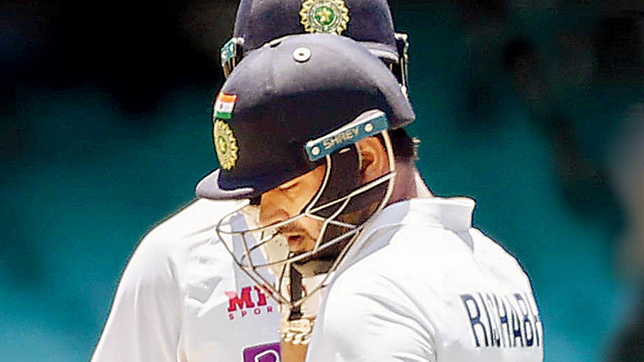 India’s Rishabh Pant (right) after being hit on the helmet by Mitchell Starc during the Sydney Test in 2021. Pics/Getty Images