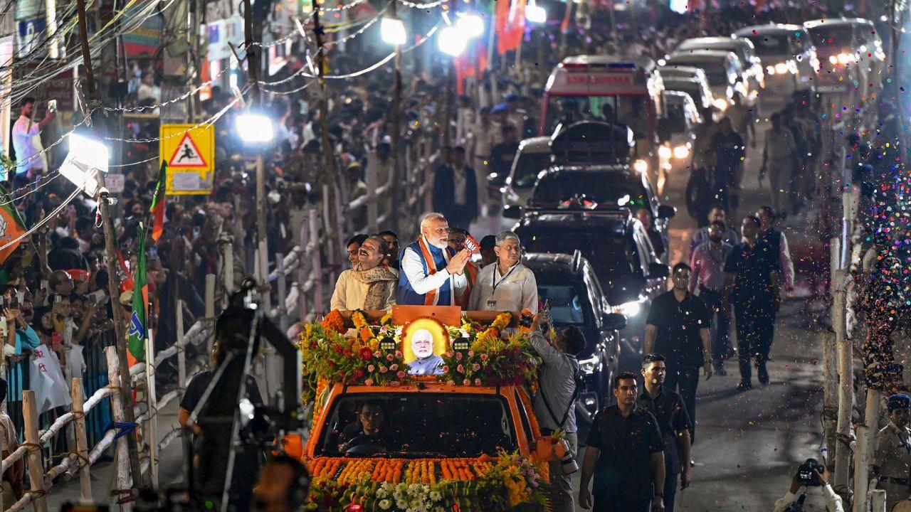 A large number of people gathered to catch a glimpse of Modi, who is touring the state to campaign for the assembly elections