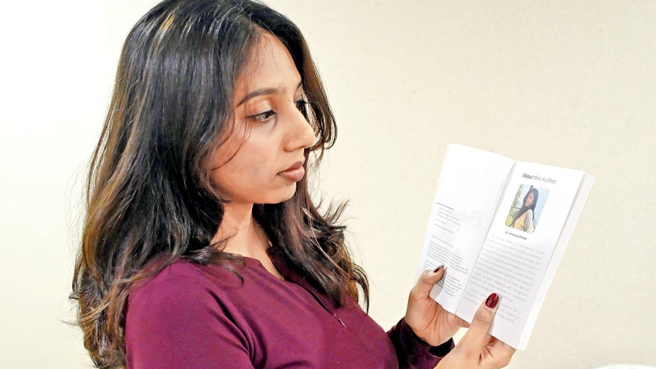 Author Atharwa Shinde with the book