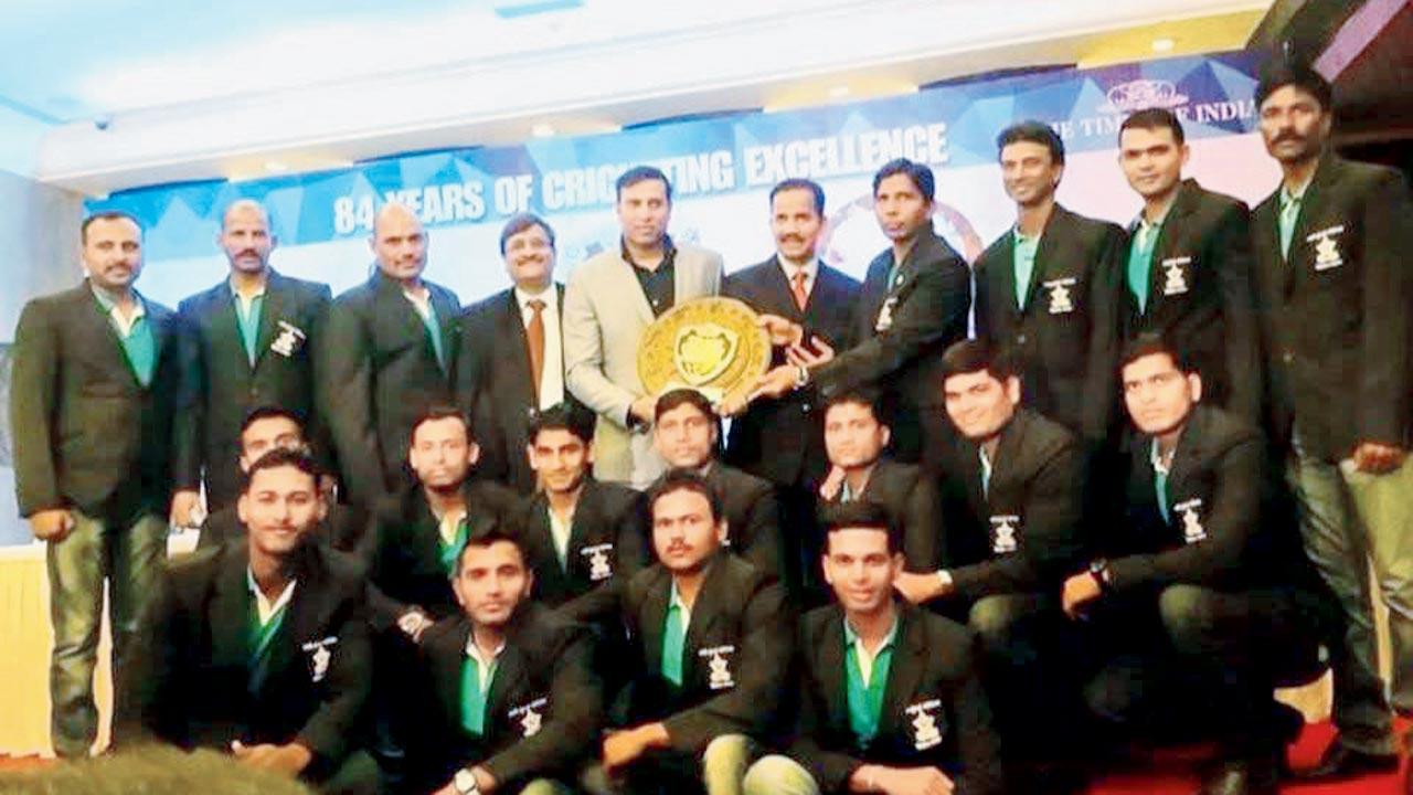 The team with one of the awards they won. Pic/By Special Arrangement