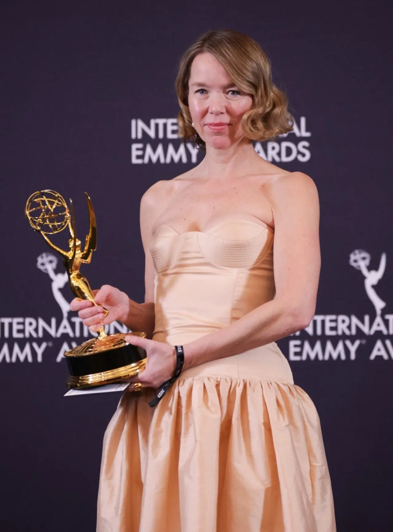Anna Maxwell Martin stunned at the red carpet as well as on stage as she collected an International Emmy for her role in the U.K. true-crime drama Until I Kill You. She looked pretty in a beige corset sweetheart neckline dress that flared up at the waist.