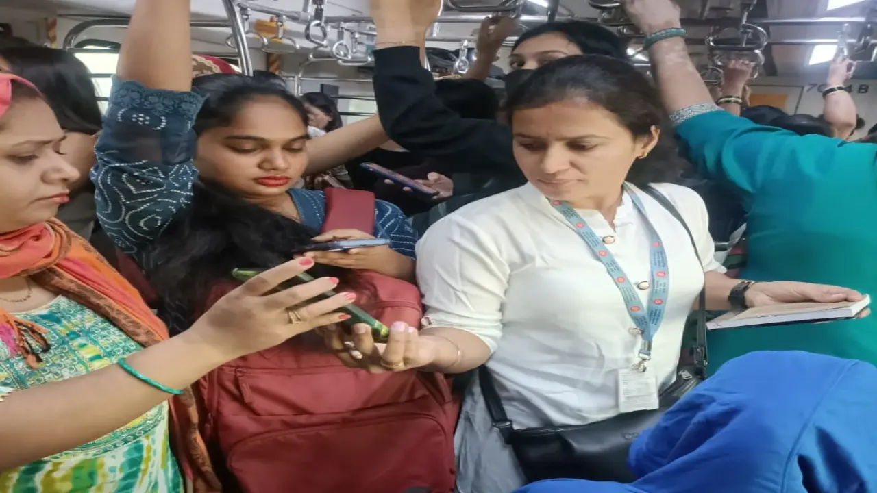 A Central Railway official checks tickets on Mumbai local train. PIC/CENTRAL RAILWAY