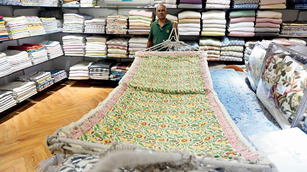 An employee lays out a canvas hammock