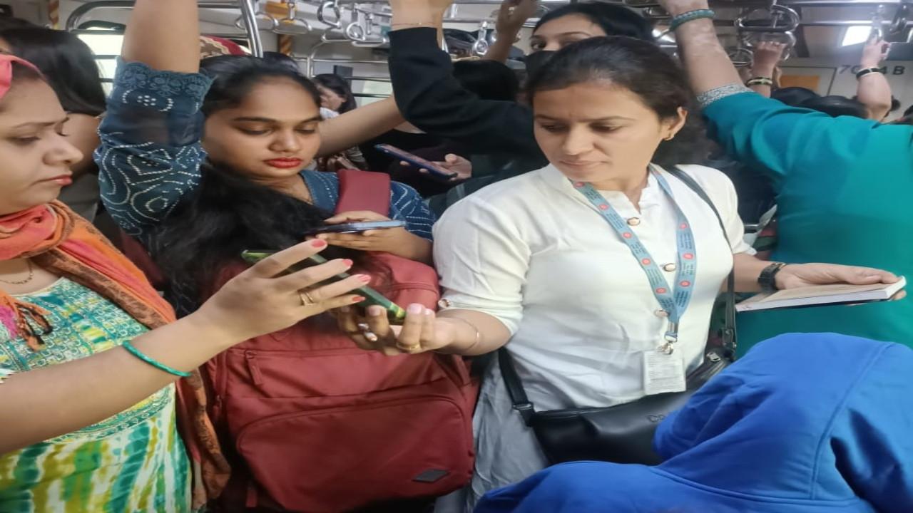 A railway official checks tickets on a Mumbai local. PIC/CR