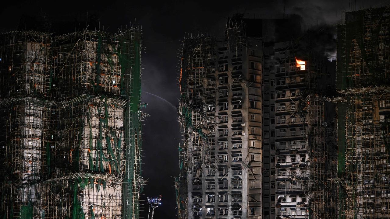 Rescuers holding flashlights were going from apartment to apartment at the charred towers as thick smoke continued to pour out from some windows at the Wang Fuk Court complex, a dense cluster of buildings housing thousands of people in Tai Po district, a northern suburb near Hong Kong's border with the mainland