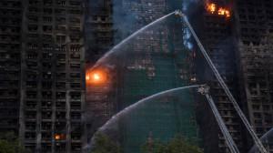 IN PHOTOS: At least 75 dead as Hong Kong firefighters battle burning towers 