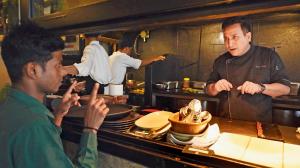 India's deaf community opposes PIL for American Sign Language A staff member speaking to Vinod Maithani, brand chef at Ishaara, who learnt signing to communicate with hearing-impaired staff