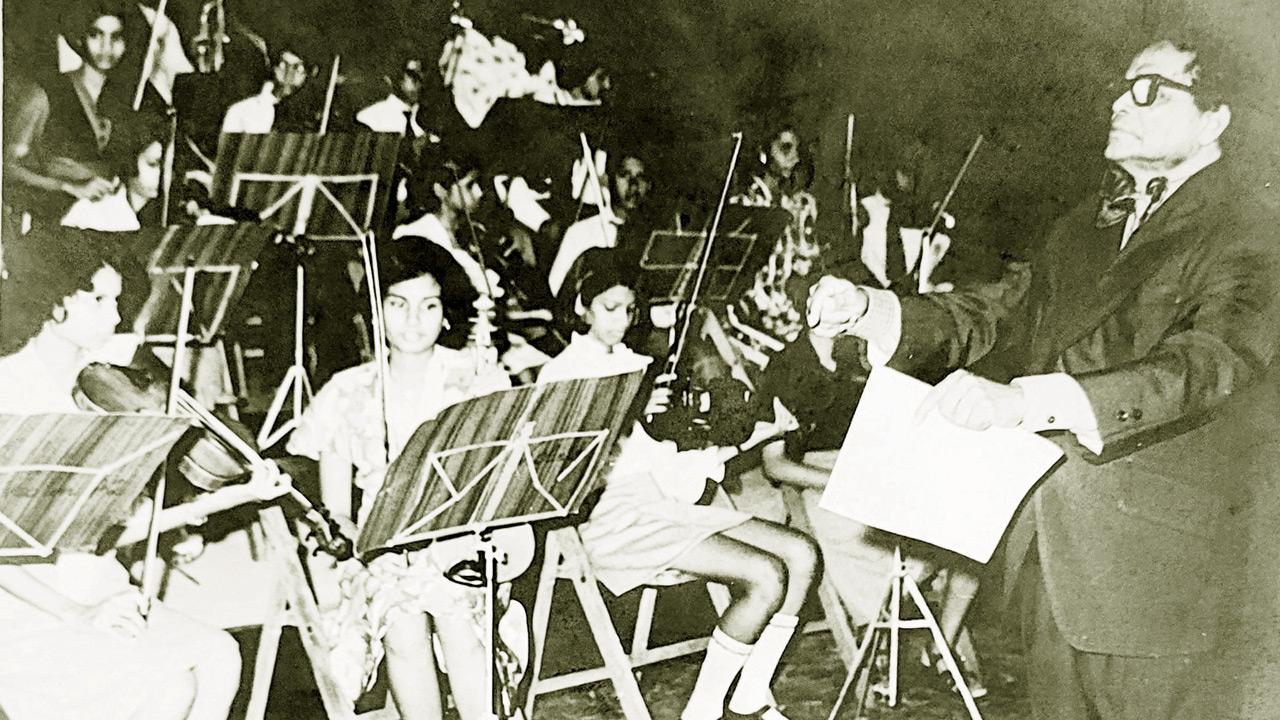 Menzie conducting a show of the Pops Symphony Orchestra which he founded. Pic courtesy/Myra Shroff