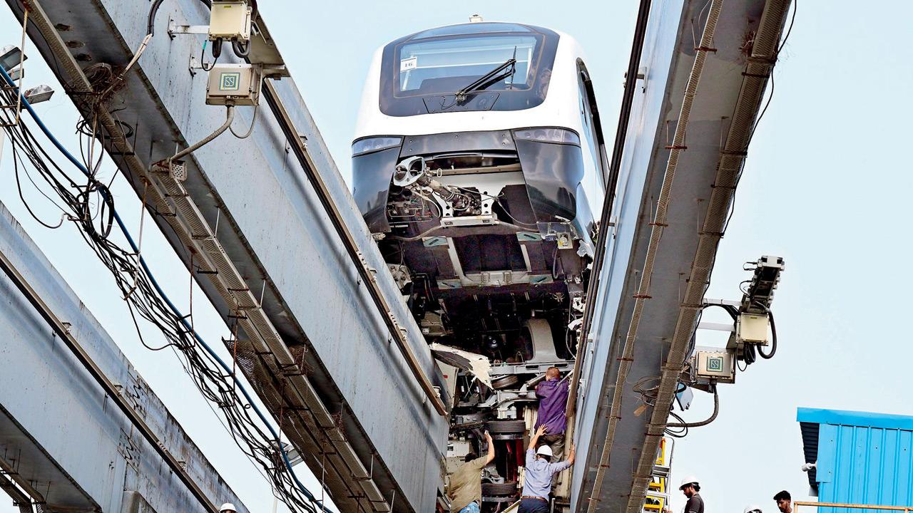 Monorail rake lifted in air due to impact with guide beams. PIC/SHADAB KHAN