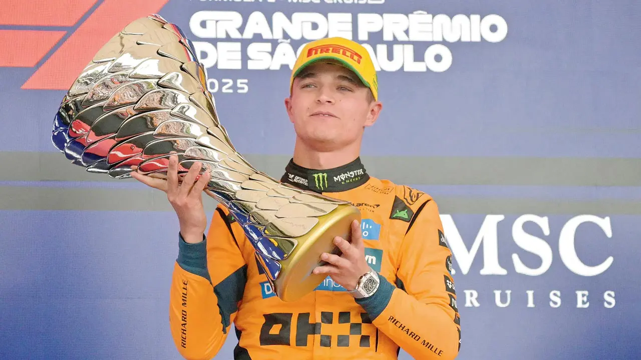 McLaren’s Lando Norris lifts the trophy after winning the Sao Paulo GP on Sunday. Pic/AFP