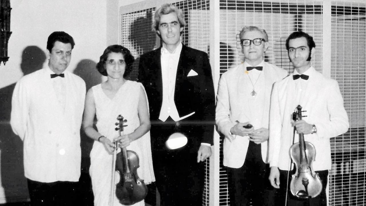 (From left) Parvez Doctor of the BP Saloon Orchestra, Jini Dinshaw, conductor Joachim Buehler, cellist George Lester and Freddy Dinshaw (now BCO’s oldest member), backstage at a 1970s performance at the Homi Bhabha Auditorium