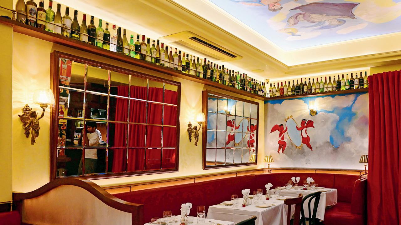 Artist Kacper Abolik has painted the playful cherubs on the artwork and frescos at the restaurant