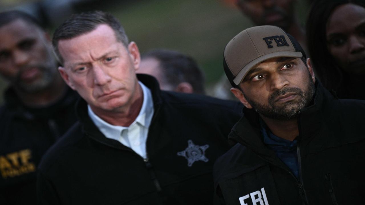 US Secret Service Director Sean Curran (left) and FBI Director Kash Patel at the scene. Patel said the shooting is being investigated as an act of terrorism