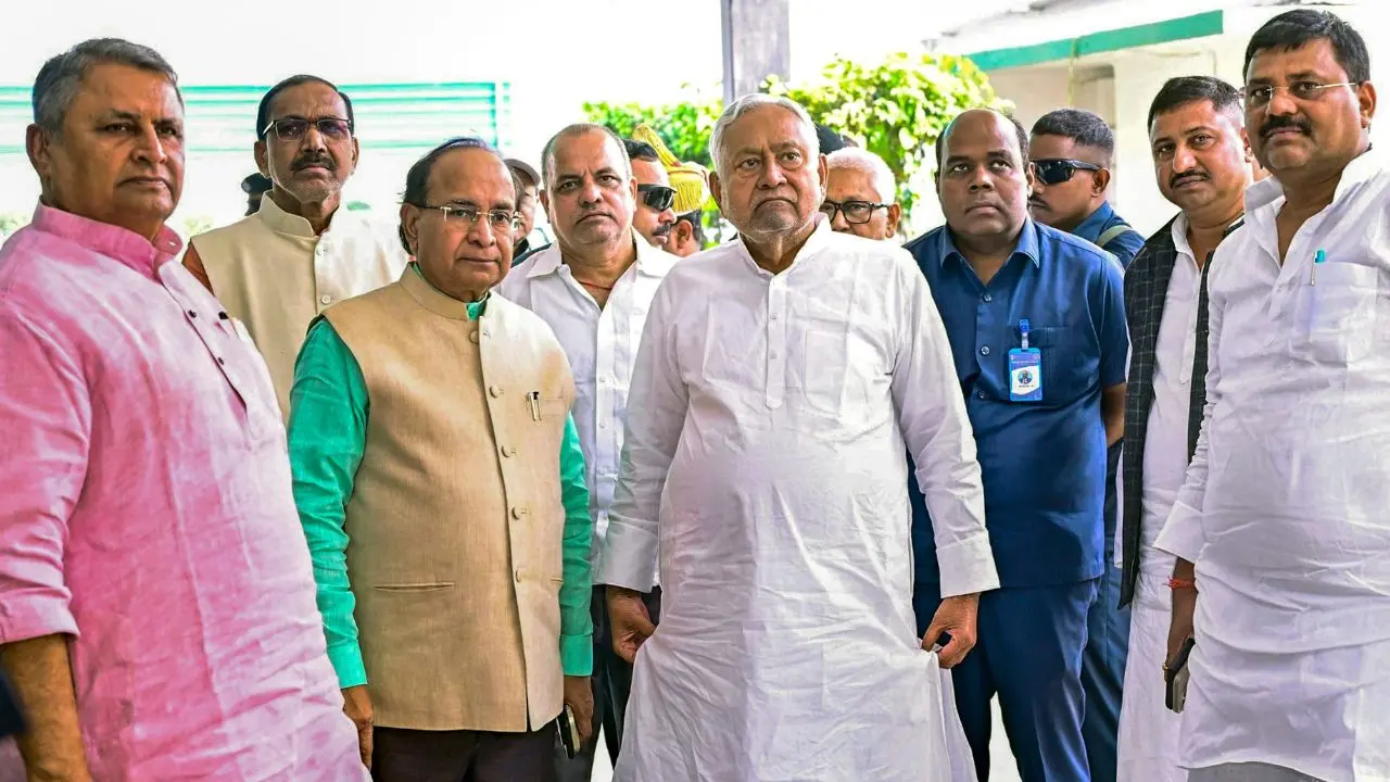 Bihar elections 2025: Will Nitish Kumar emerge as the longest-serving CM? JD(U) chief Nitish Kumar standing with other leaders awaiting 2025 election results. Pic/PTI