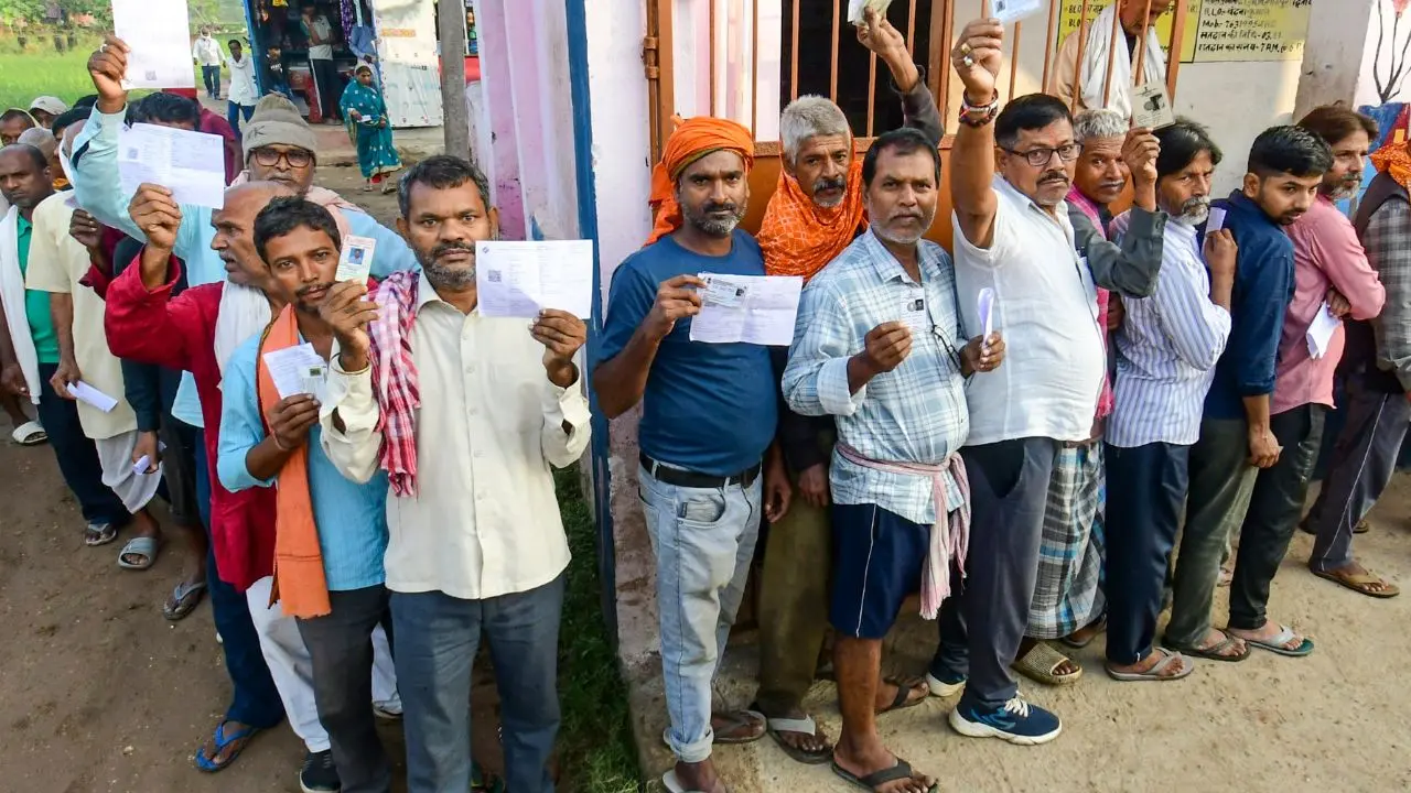 Bihar elections 2025: From Darbhanga to Dadar, Biharis wants change Voters standing in queue to cast their votes during the Bihar elections 2025. (Pic/PTI)