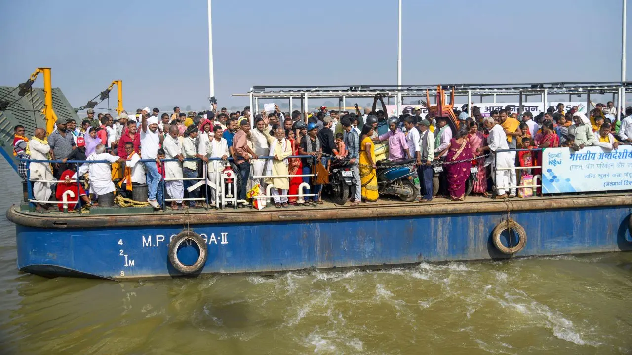 Voters cross the Ganga River in a boat to reach the polling station in Danapur, Patna, on Thursday. PIC/ PTI