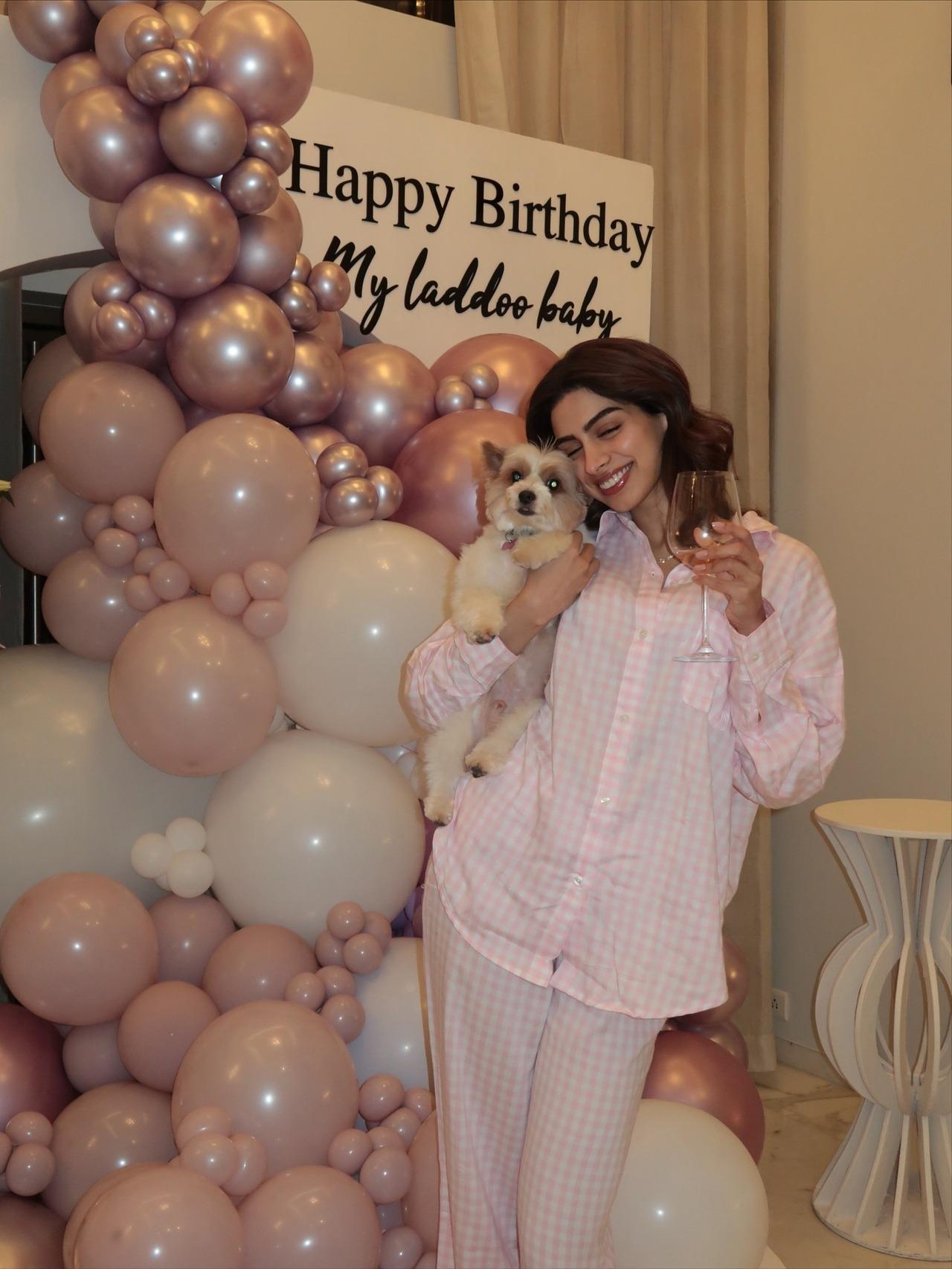 In one of the pictures, Khushi was seen cutely leaning on her pet dog, whom she held close in one hand with a wine glass in another.