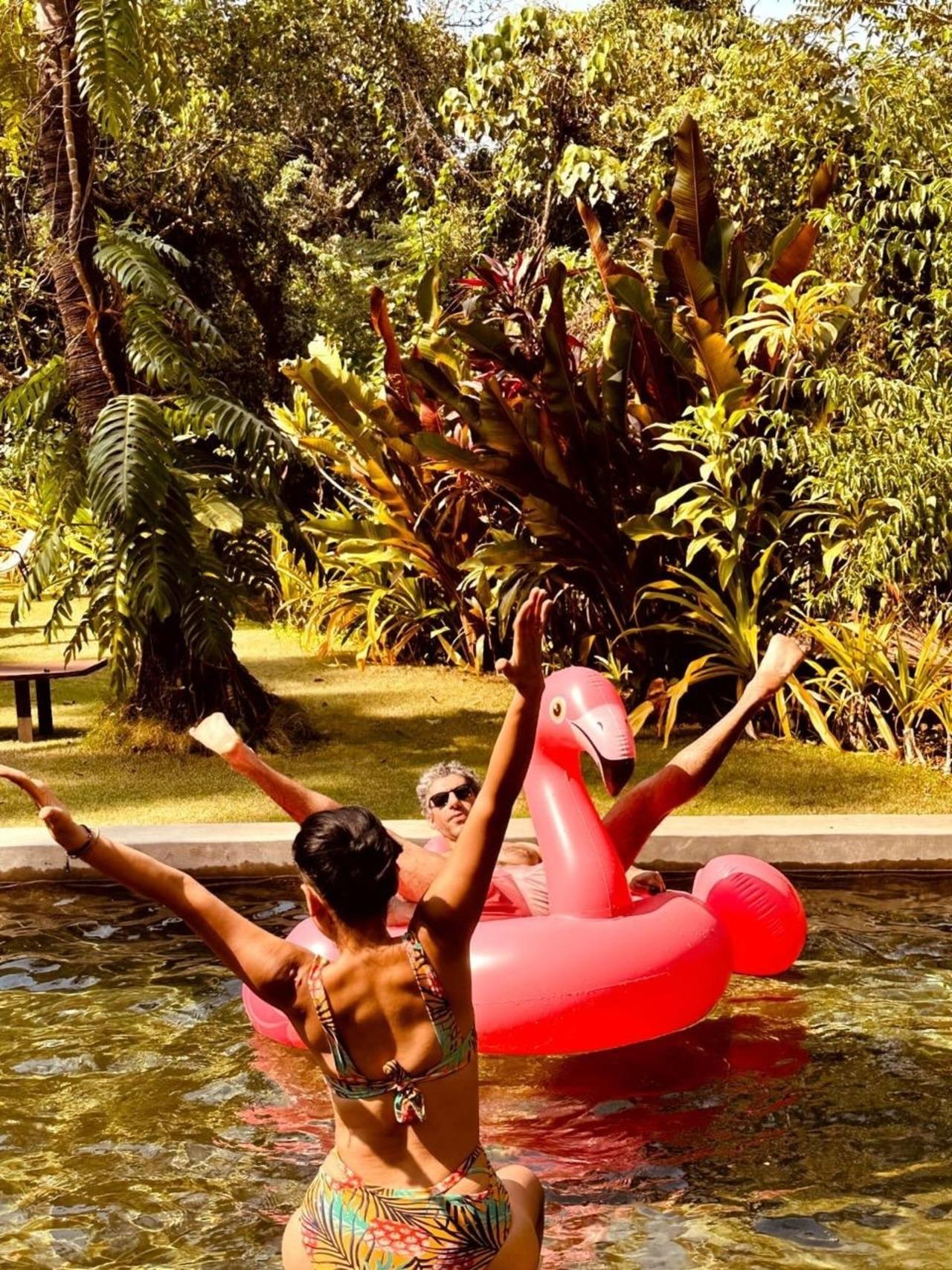<p>Another picture captured them enjoying in the pool, Tillotama is seen with her back facing the camera in a printed bikini while Jim is lounging on a flamingo float.</p>