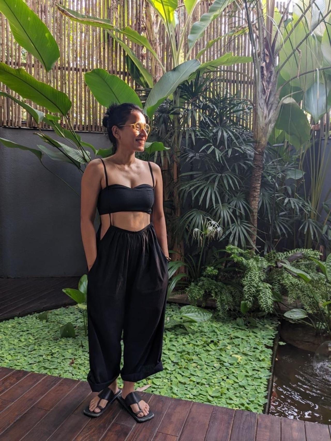 <p>Tillotama was seen looking ultra-stylish in an all-black outfit against a lush green backdrop in one of the pictures.</p>
