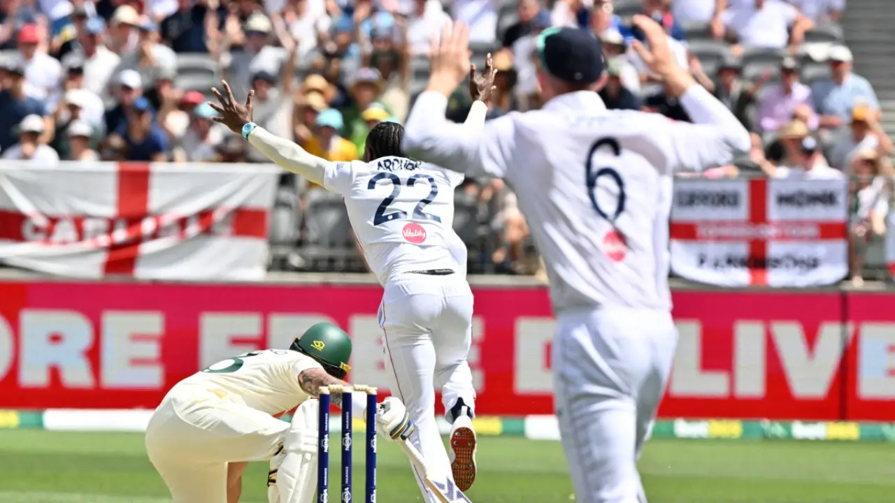 Australia’s Jake Weatherald falls to the ground after being trapped leg-before by England’s Jofra Archer (Pic: AFP)