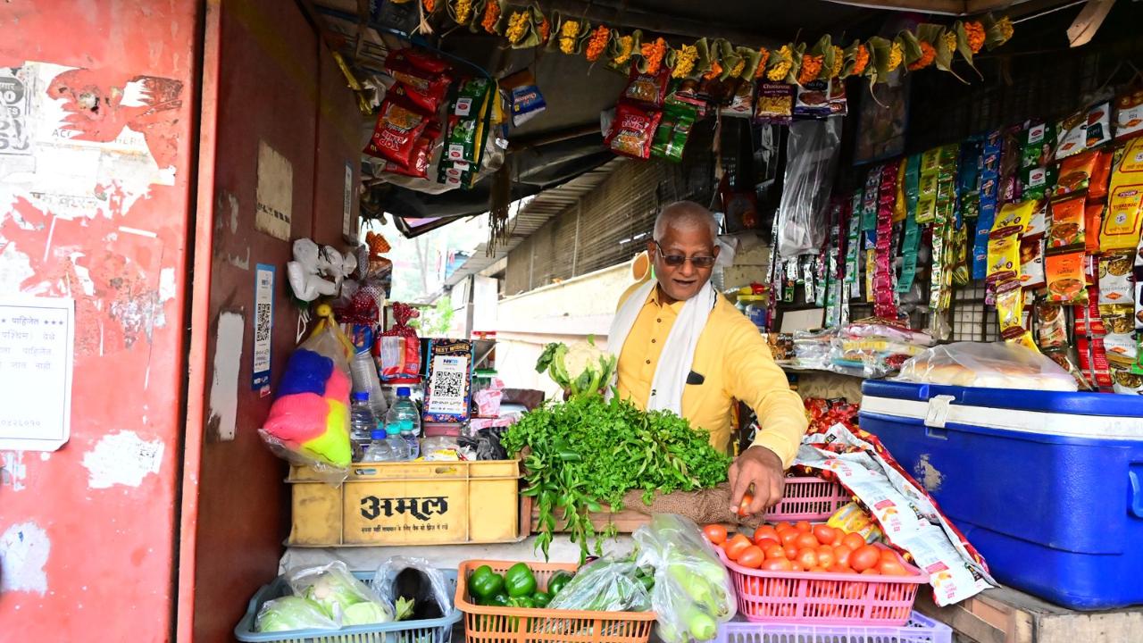 Radha's father, Omprakash Yadav, to date runs a vegetable stall outside their building in Saibaba Nagar in Kandivali West, Mumbai (Pic: Nimesh Dave)