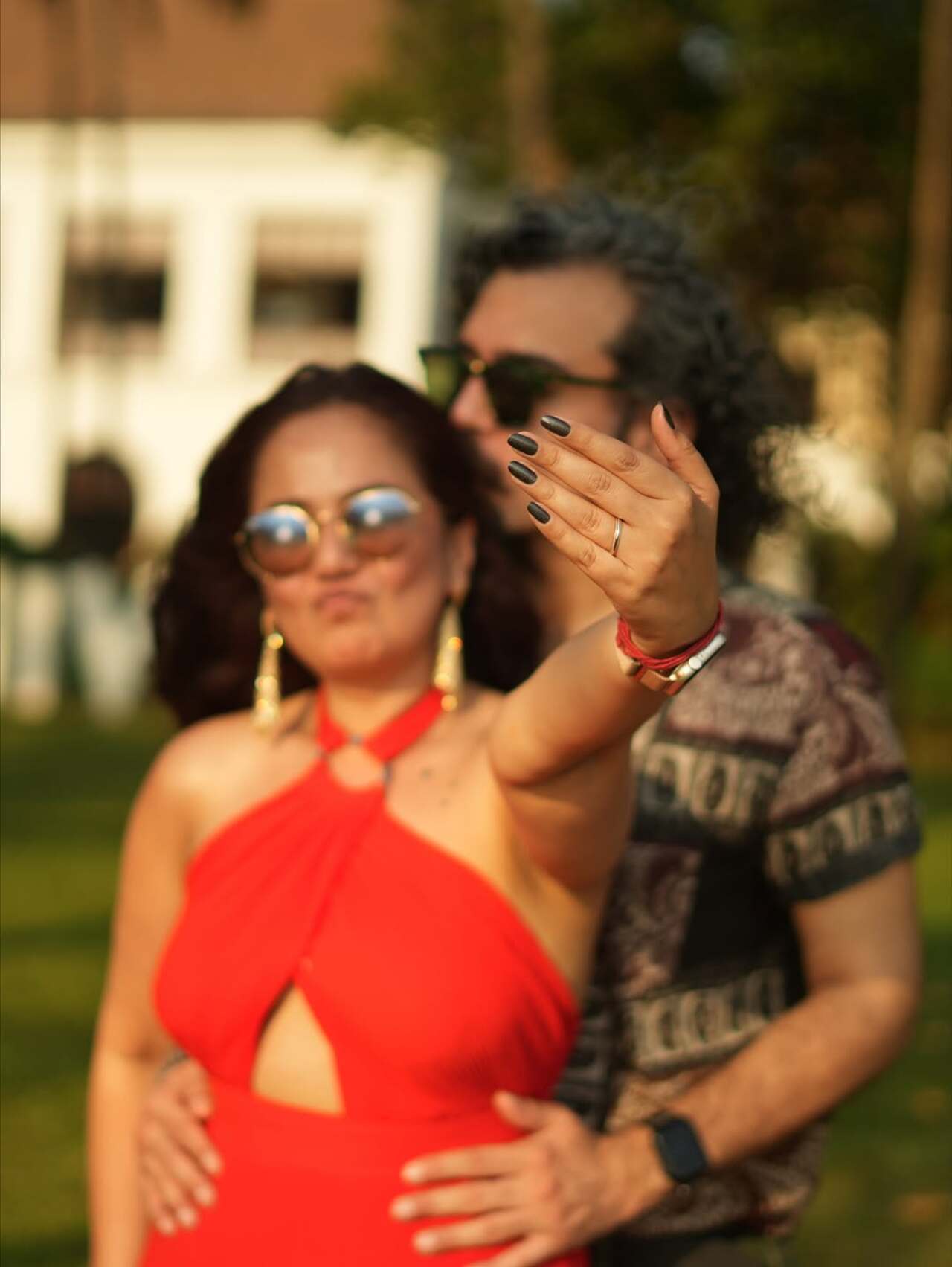 Roopal flaunts her stunning ring as they strike a pose together