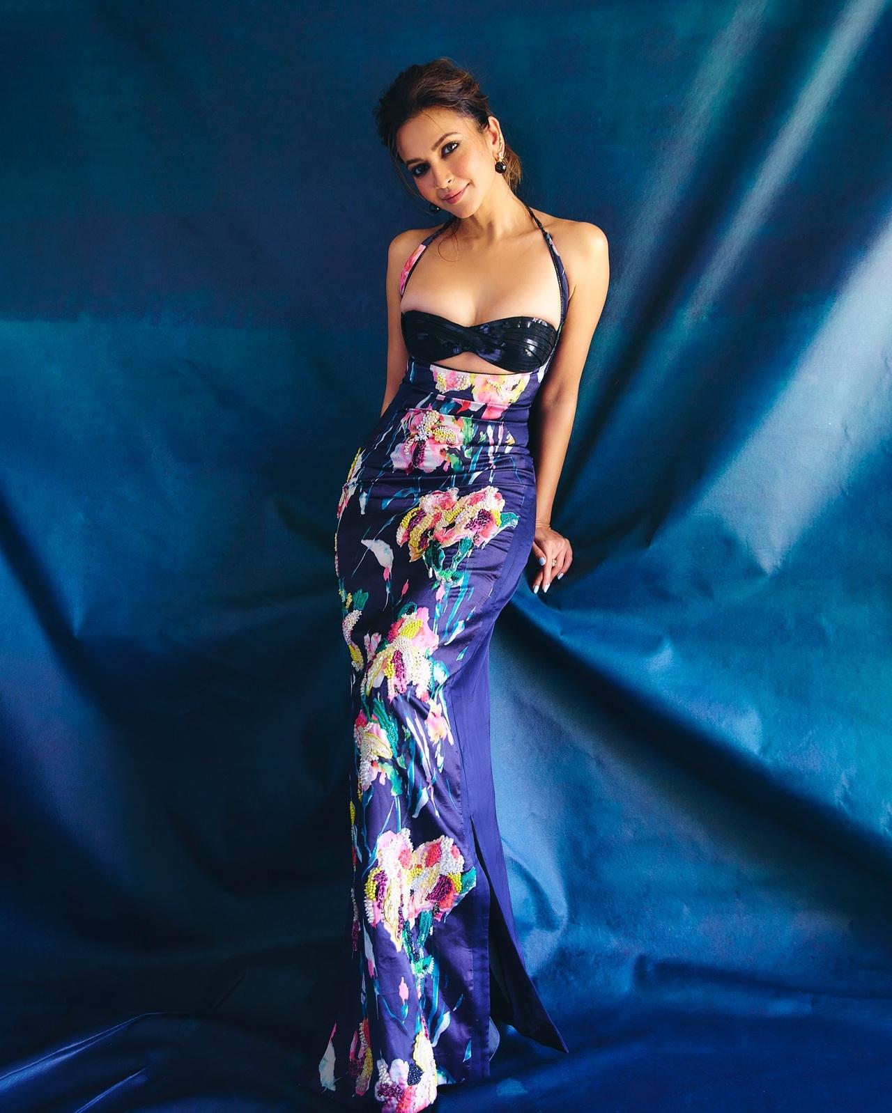 Romantic yet rebellious, Kriti dazzles in a form-fitting floral number that celebrates the art of contrast. The black base highlights her confidence, while the vibrant blossoms breathe in vitality and passion.