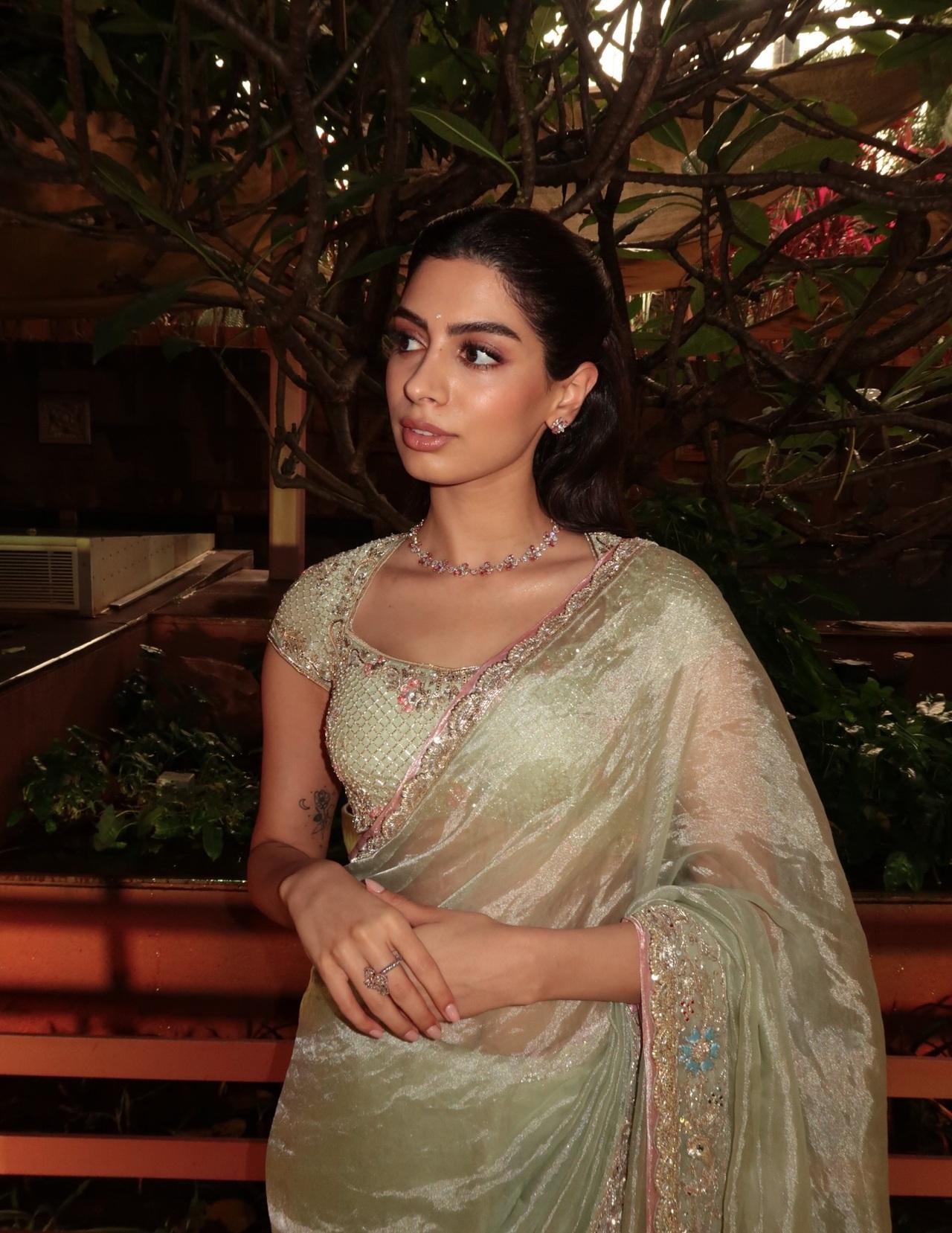 Khushi Kapoor looks dreamy in this pastel green saree that radiates soft elegance. The delicate shimmer and intricate border add just the right amount of sparkle, making it perfect for daytime wedding festivities.