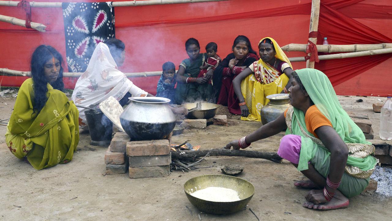 PatnaWomen preparing ‘prasad’ as part of ‘Kharna Puja’ during the Chhath Puja festival.